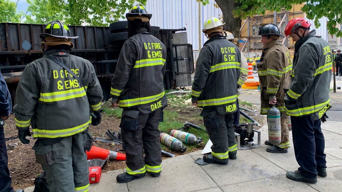 DC emergency workers near overturned truck