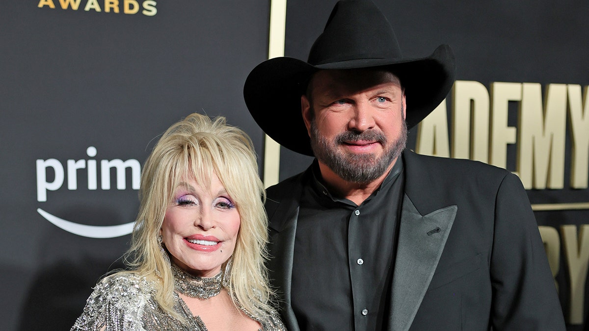 Dolly Parton and Garth Brooks on the 2023 ACM red carpet