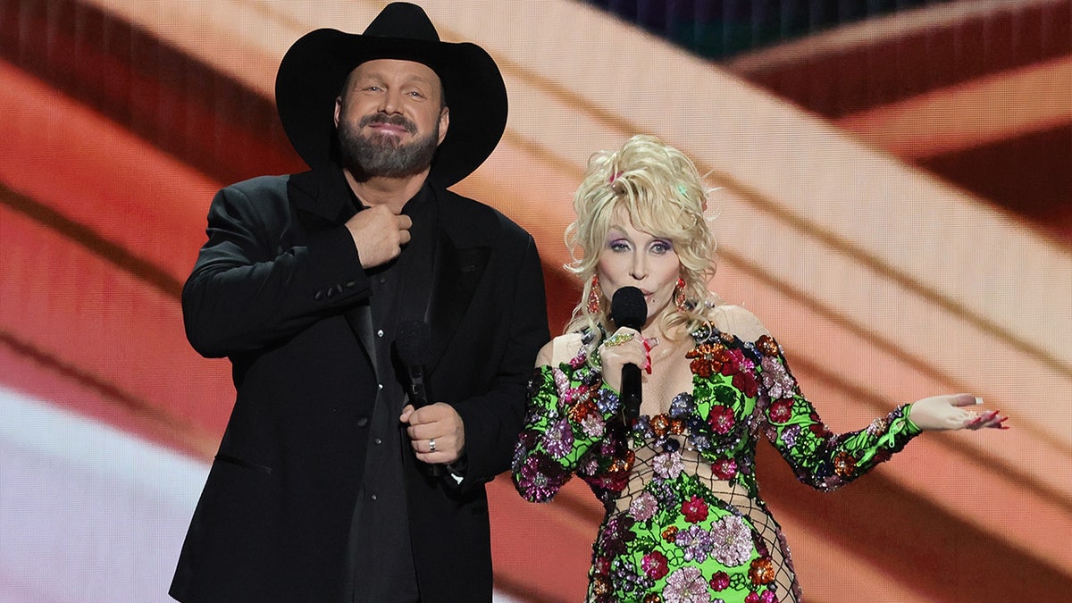 Dolly Parton wears glittering dress with Garth Brooks on stage at country music awards