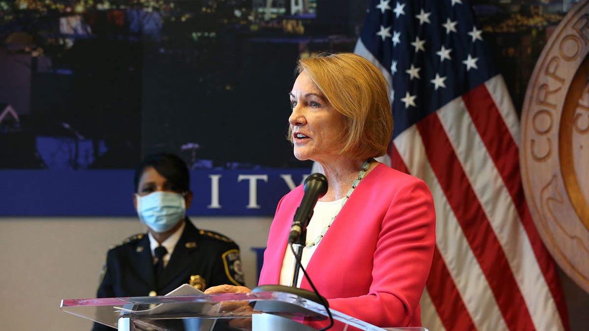 Seattle Mayor Jenny Durkan, right, speaks at a press conference while Seattle Police Chief Carmen Best stands nearby on Aug. 11, 2020, in Washington. Seattle plans to settle a lawsuit with $2.3 million after whistleblowers helped reveal that thousands of Durken’s text messages were deleted in 2020 as protests intensified over George Floyd’s death.