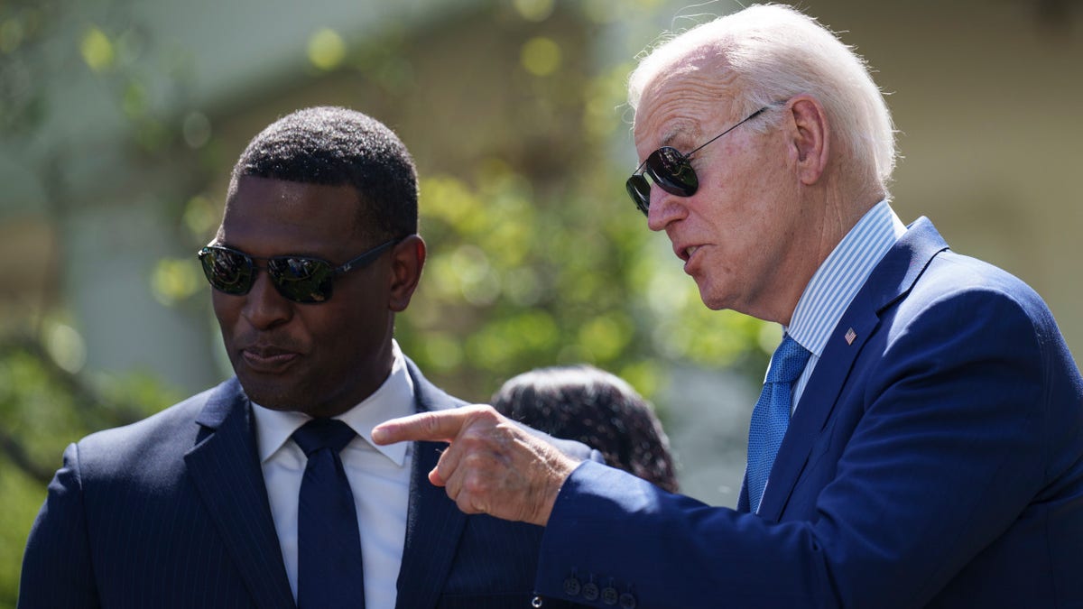 U.S. President Joe Biden talks to EPA Administrator Michael Regan