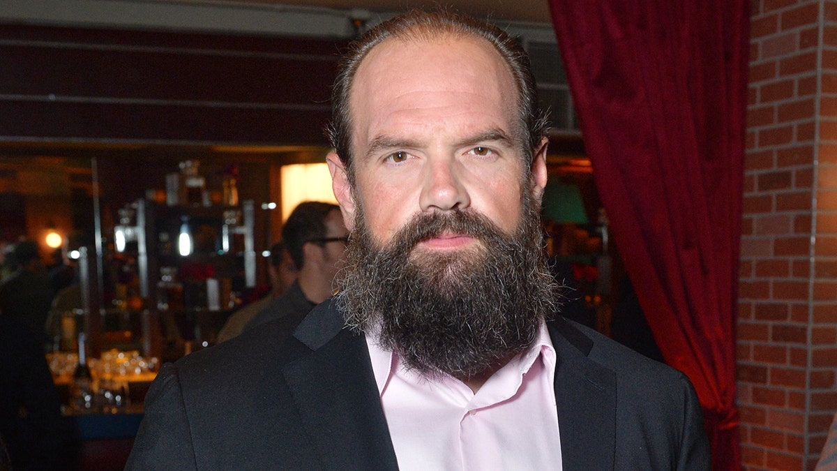 Ethan Suplee wears a grey suit with a pink shirt at Hollywood event
