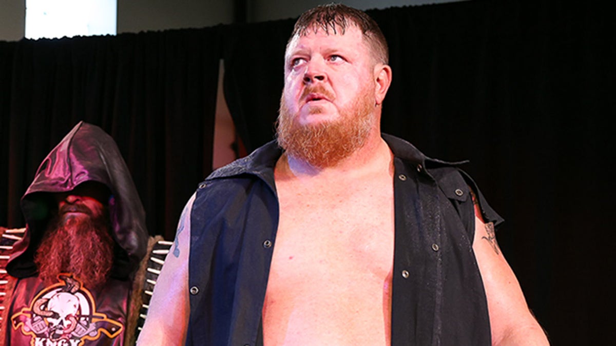 Trevor Murdoch walks with Mike Knox