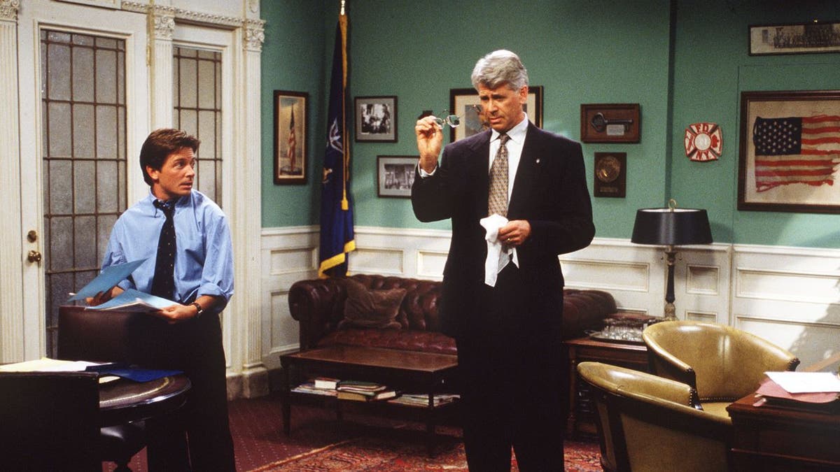 Michael J. Fox and Barry Bostwick performing together in a scene from "Spin City."