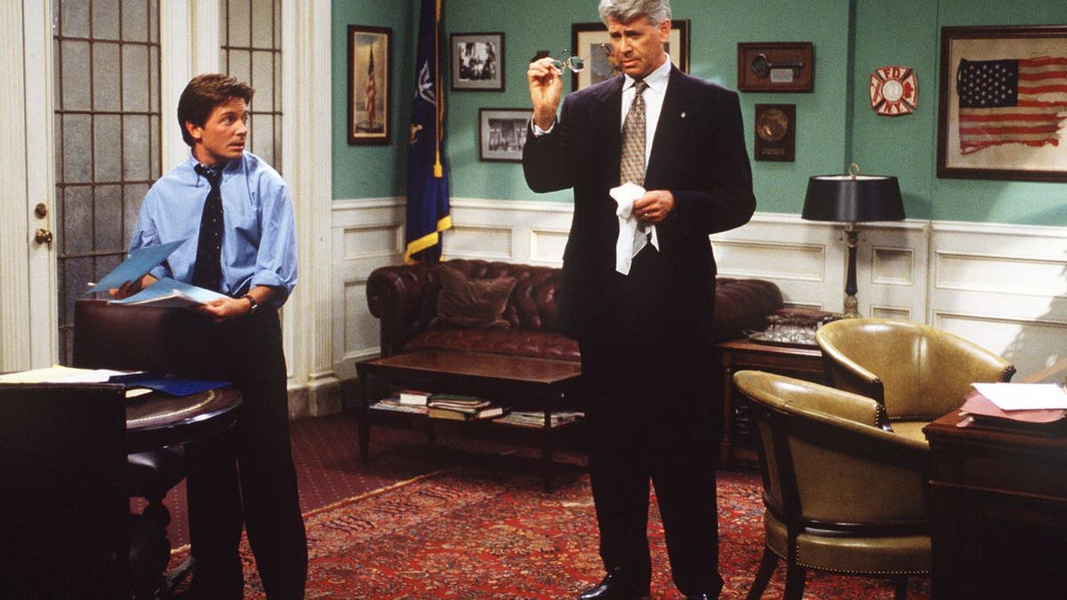 Michael J. Fox and Barry Bostwick performing together in a scene from "Spin City."