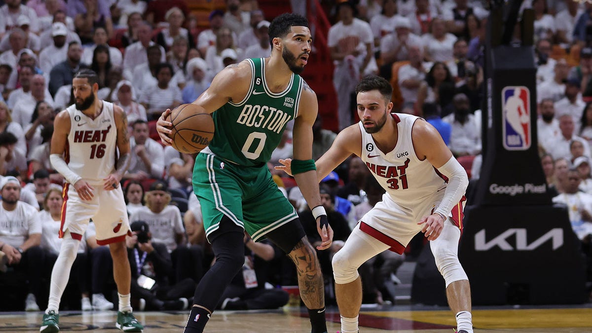 Max Strus guards Celtics player Jayson Tatum