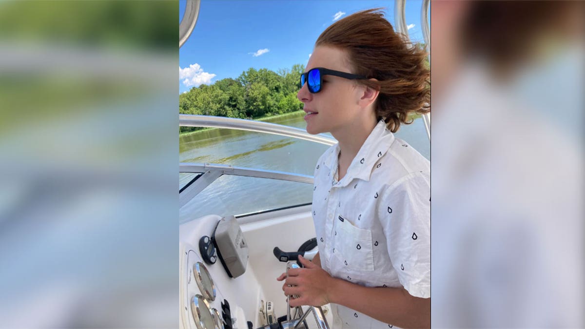 Gavin Knupp on boat wearing sunglasses