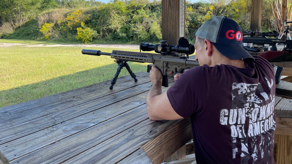 Gun owner shoots rifle