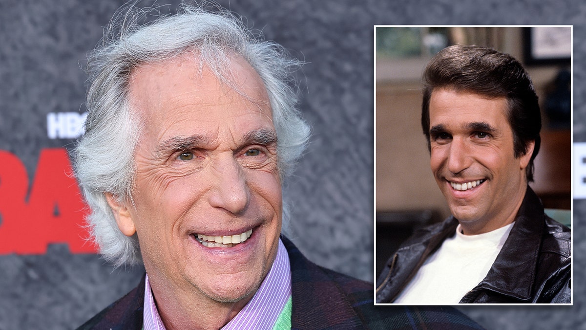 Henry Winkler smiles to his left in a plaid jacket with a bright green and lilac collar on the red carpet inset a photo of him in a brown leather jacket and white t-shirt playing "The Fonz" on "Happy Days"
