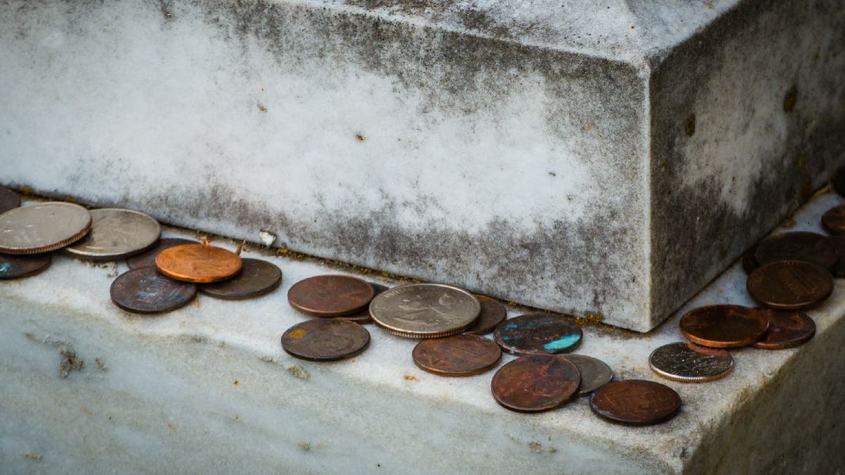 Coins left on gravestones What does it mean and why do people do