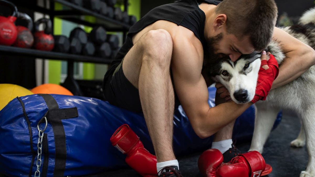 Man asks if hes wrong for bringing his dog to the gym, sparking debate on Reddit Fox News