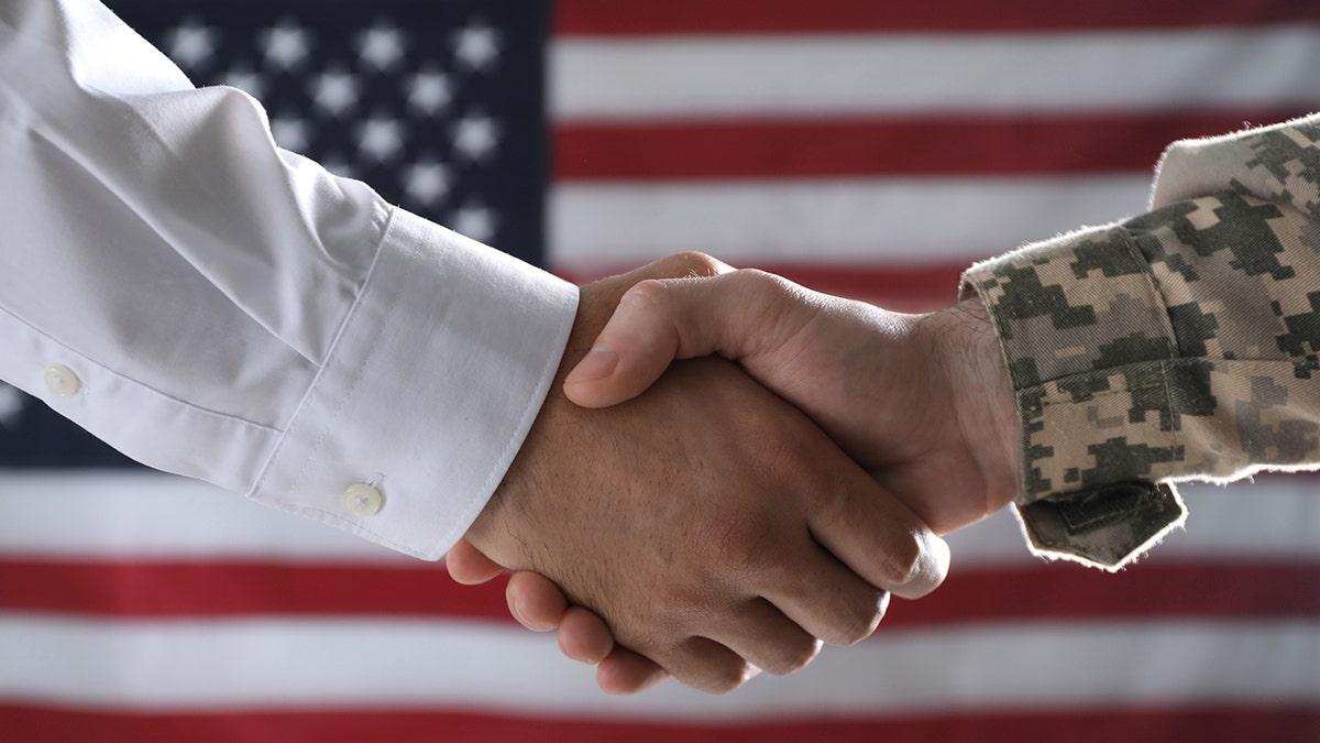 soldier shaking hands