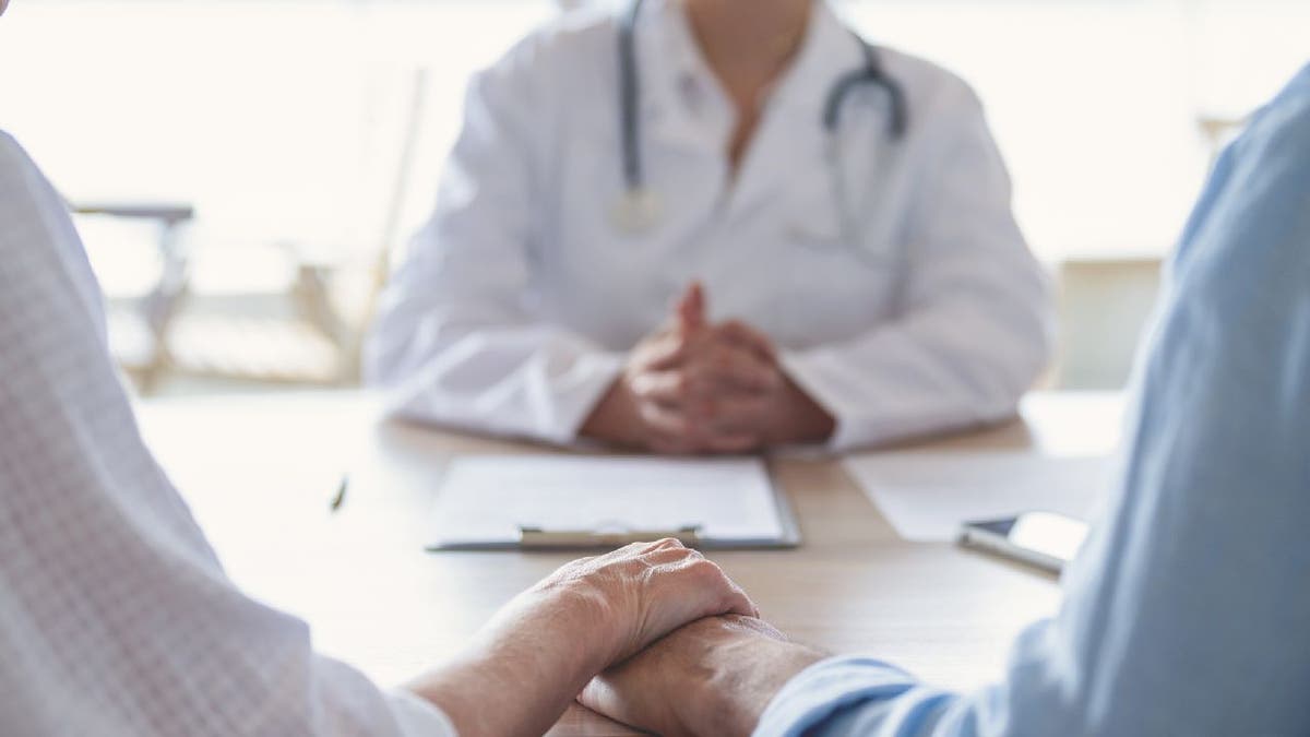 Couple meeting with doctor