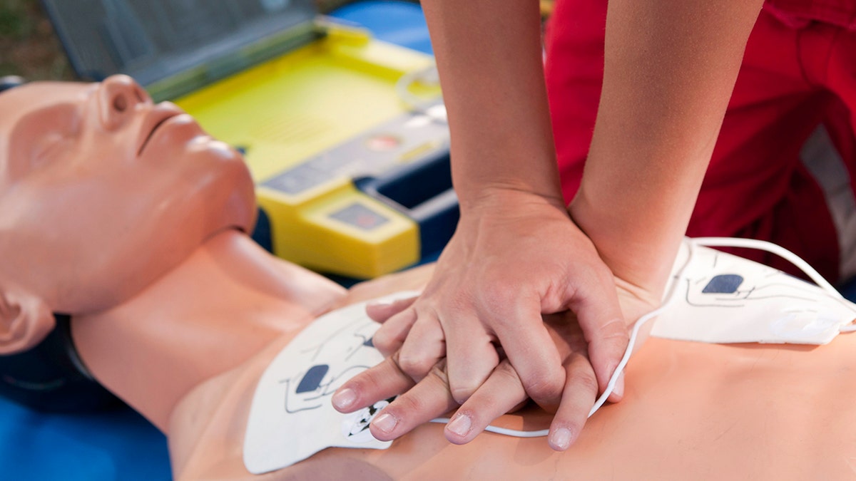 CPR practice on doll