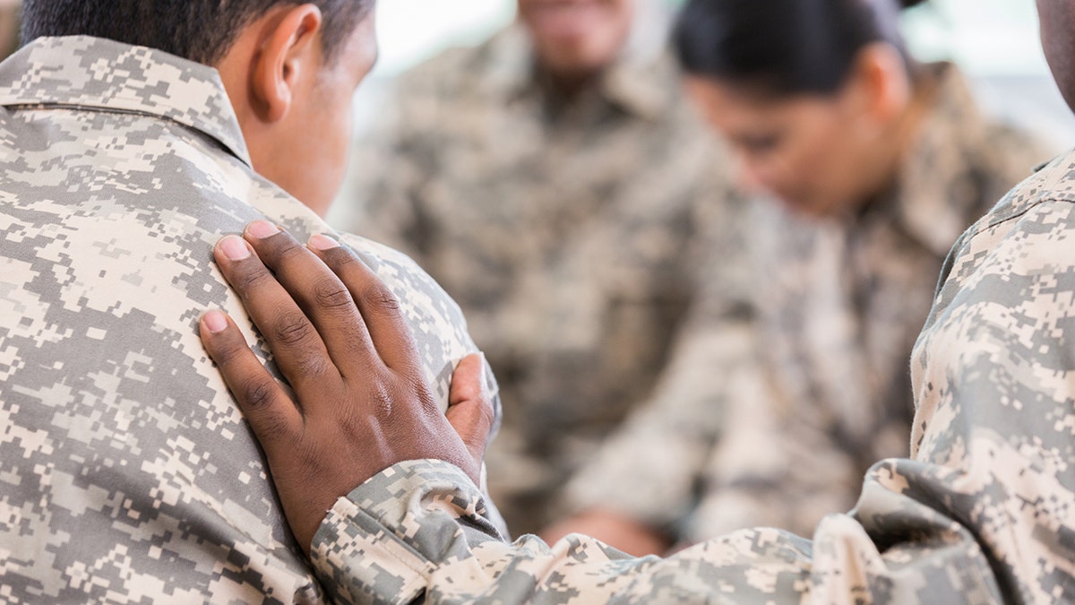 soldiers consoling eachother