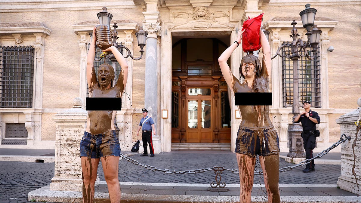 climate activists in mud