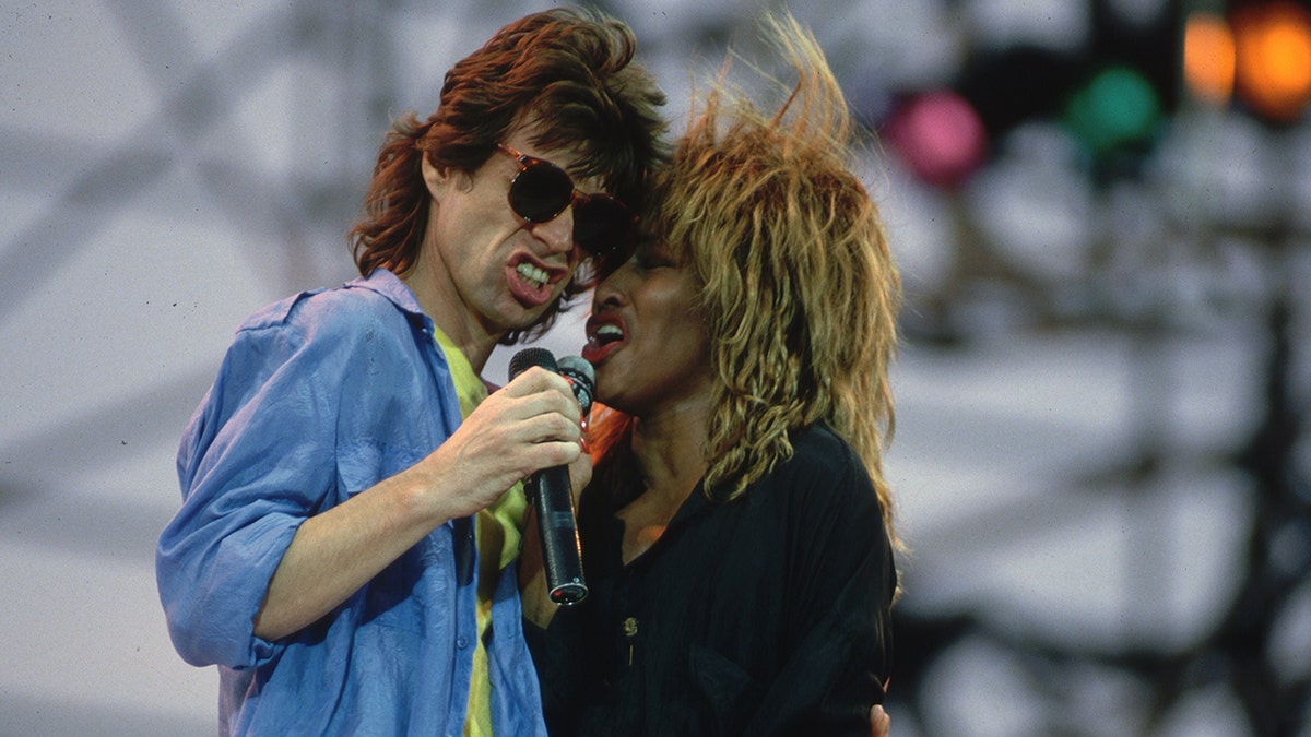 Mick Jagger and Tina Turner singing