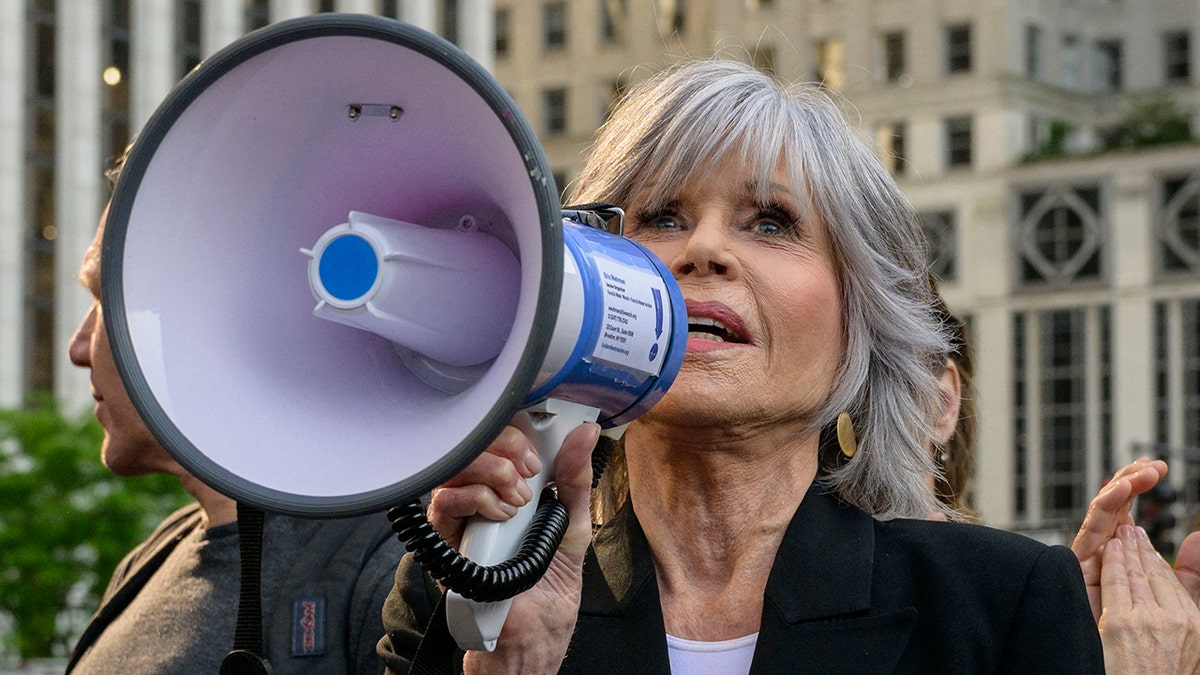 Jane Fonda with bullhorn at protest