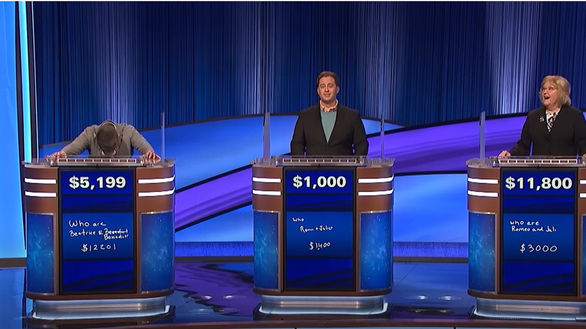 Three contestants in playing Jeopardy.