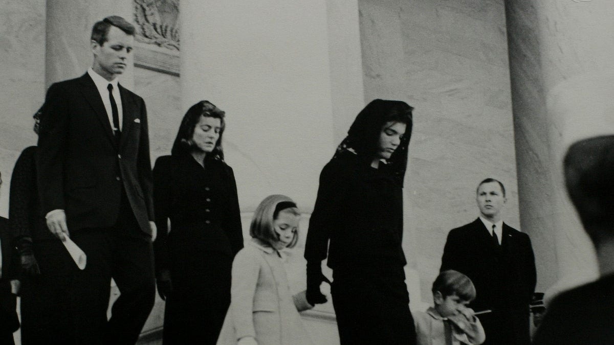 JFK casket with family nearby