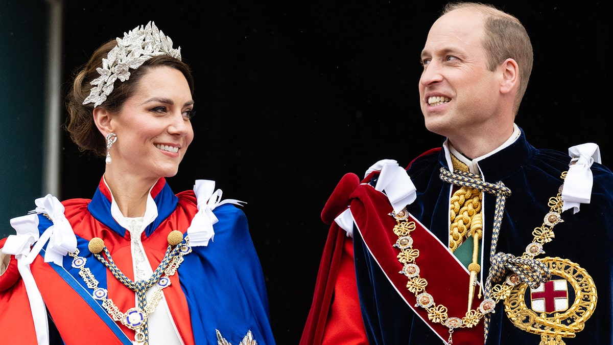 Kate Middleton wearing a fancy headpiece standing next to Prince William during the coronation