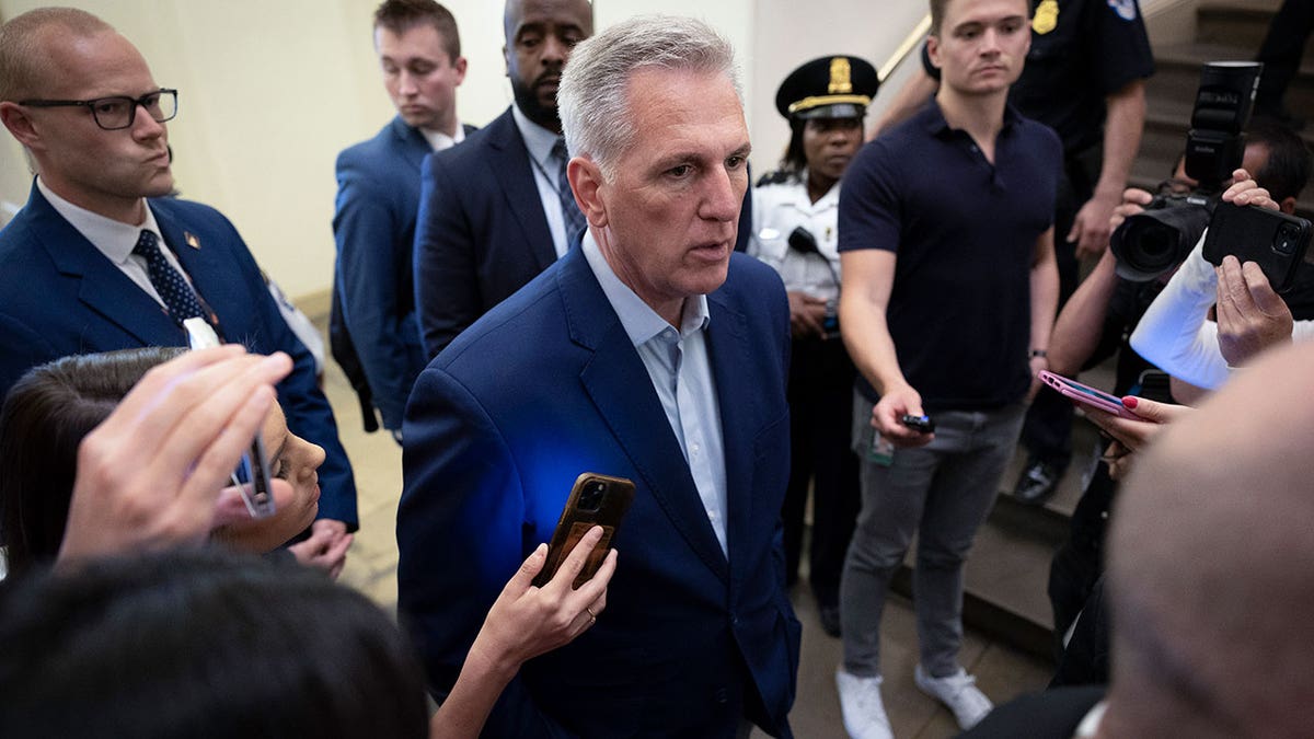 House Speaker Kevin McCarthy is surrounded by reporters