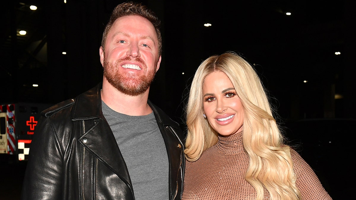 Kroy Bierman posing with Kim Zolciak