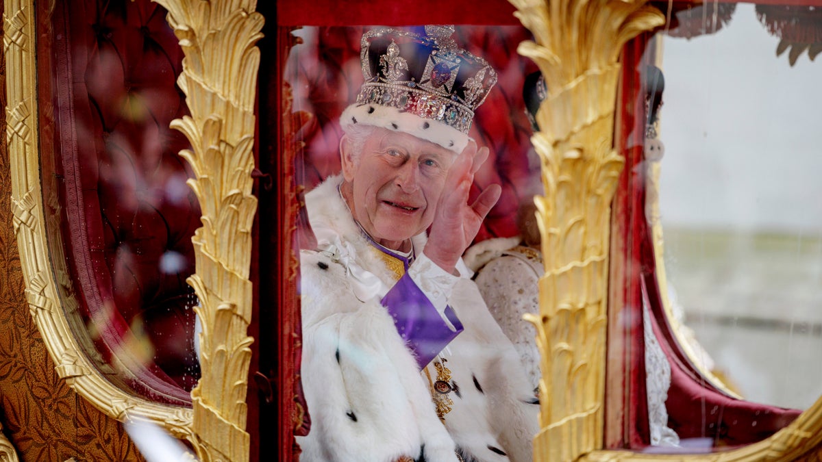 The king inside the Gold State Coach