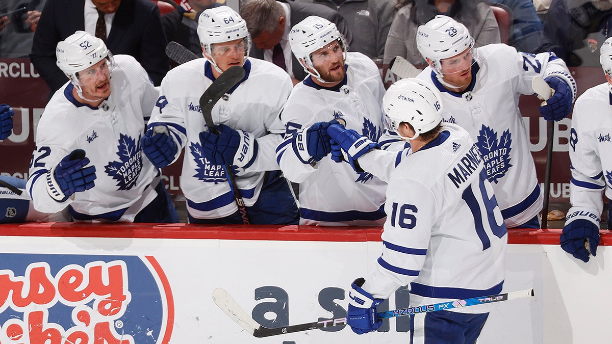 Mitchell Marner greets teammates