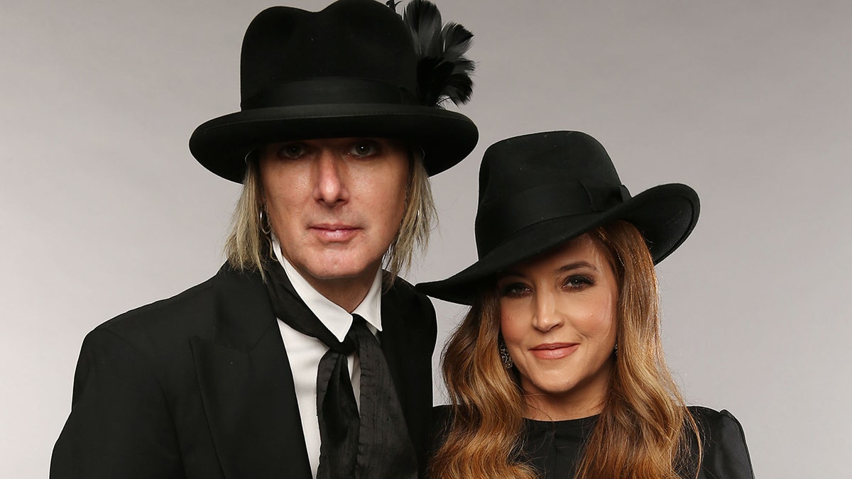 Lisa Marie Presley wears black hat to match Michael Lockwood in royal suit
