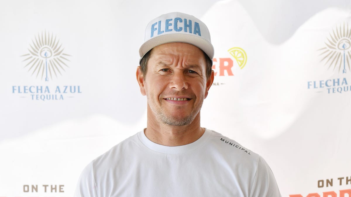 Mark Wahlberg smiles as he appears at a restaurant to promotes his tequila brand.