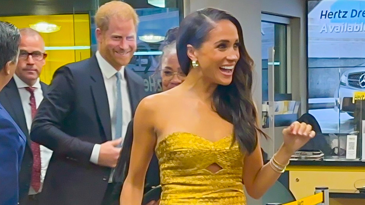 Meghan Markle flashes a smile ahead of feminist event in New York