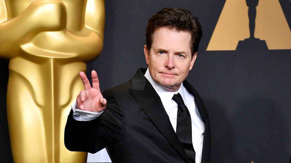 Michael J Fox held up a peace sign on the red carpet at the Oscars in 2017.