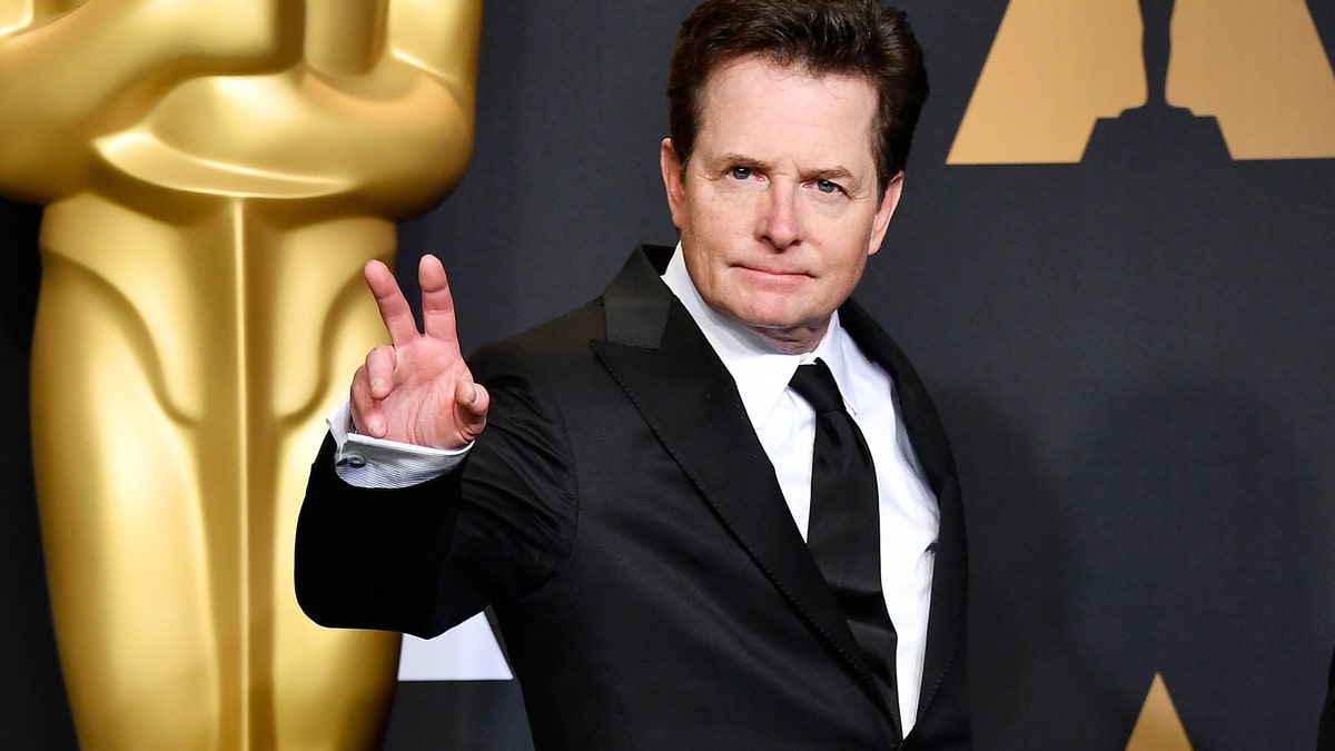 Michael J Fox held up a peace sign on the red carpet at the Oscars in 2017.