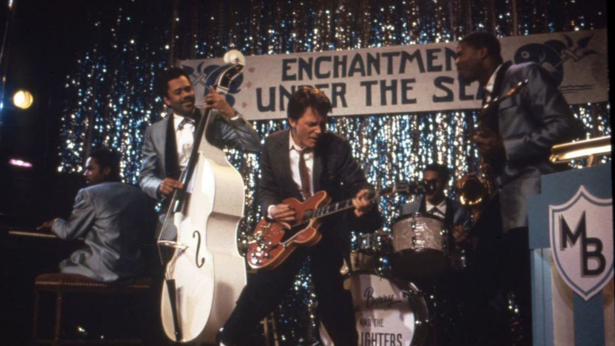 A shot from "Back to the Future" that shows Michael J. Fox's character performing with a band during prom.