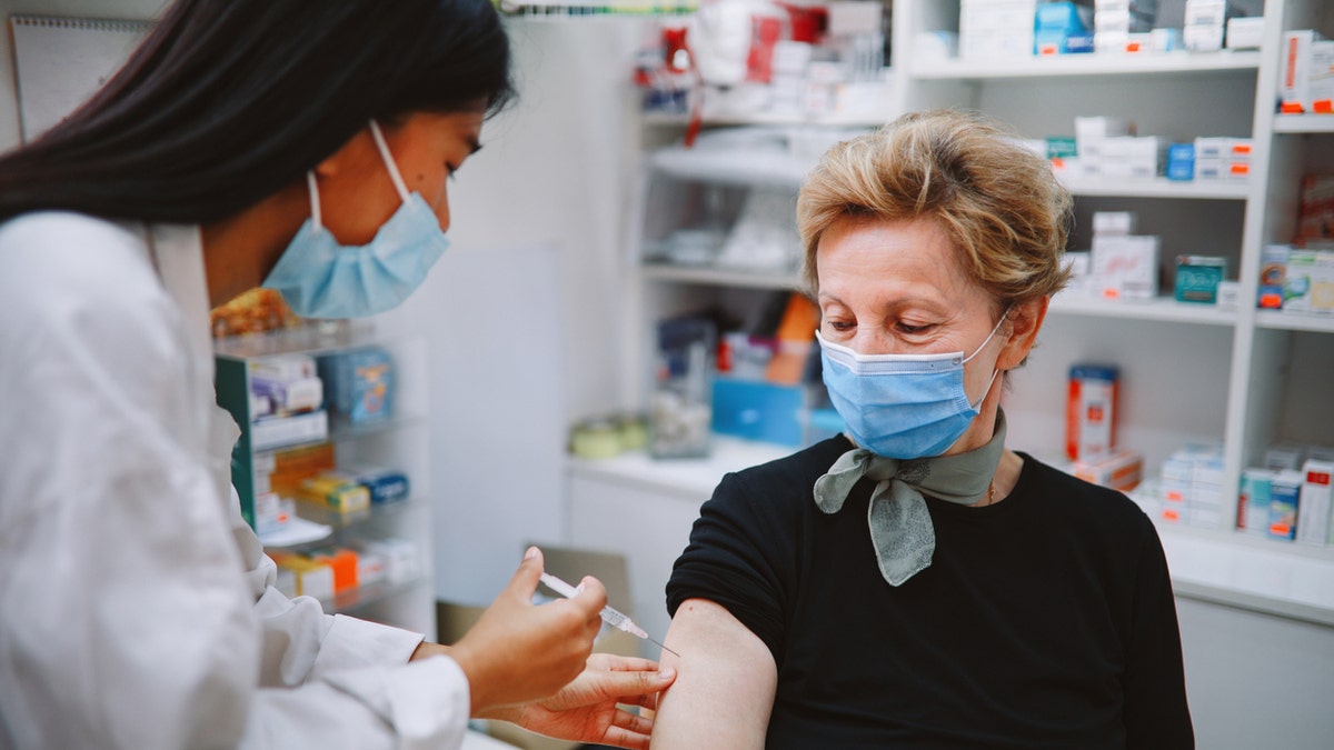 Older woman receiving vaccine