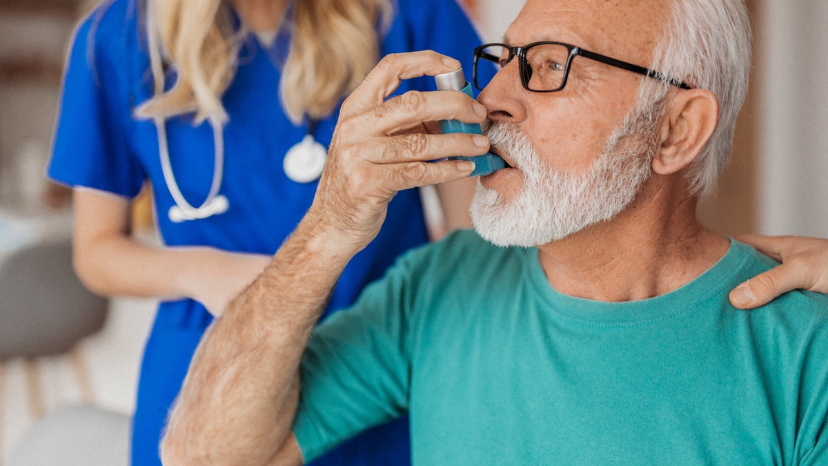 Older man with inhaler