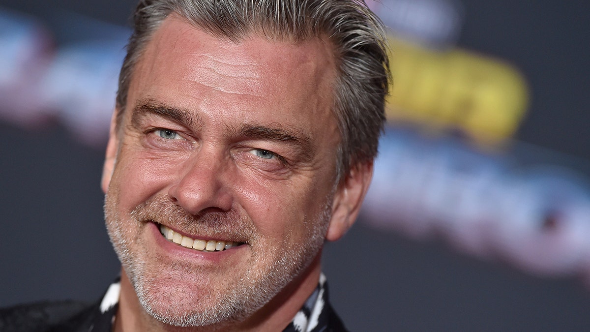 Ray Stevenson smiles in a close-up shot on the red carpet for "Thor: Ganarok" premiere