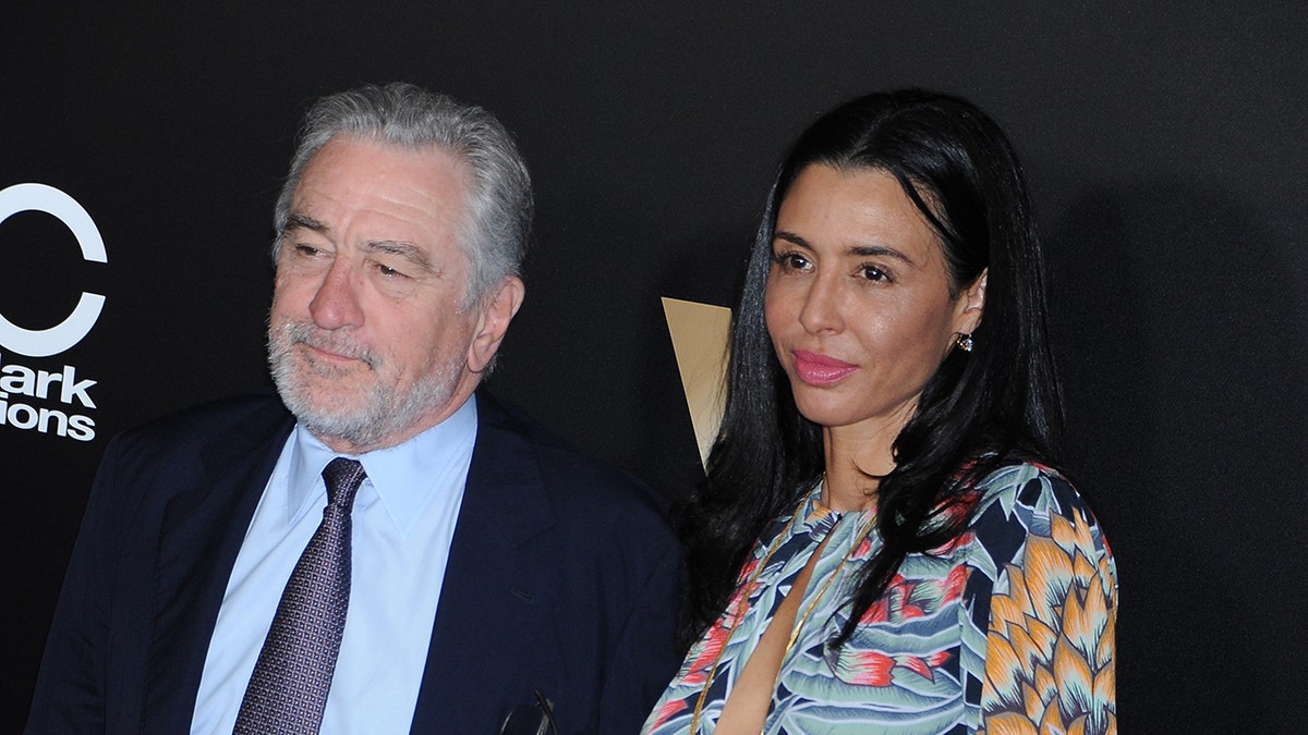 Robert De Niro with his eldest daughter Drena, on the red carpet looking away from the camera at the Hollywood Film Awards