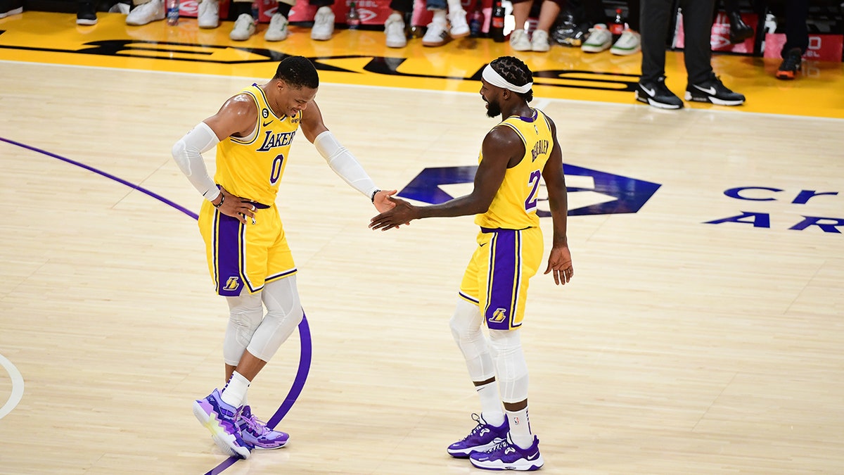 Russ and Pat Bev high five