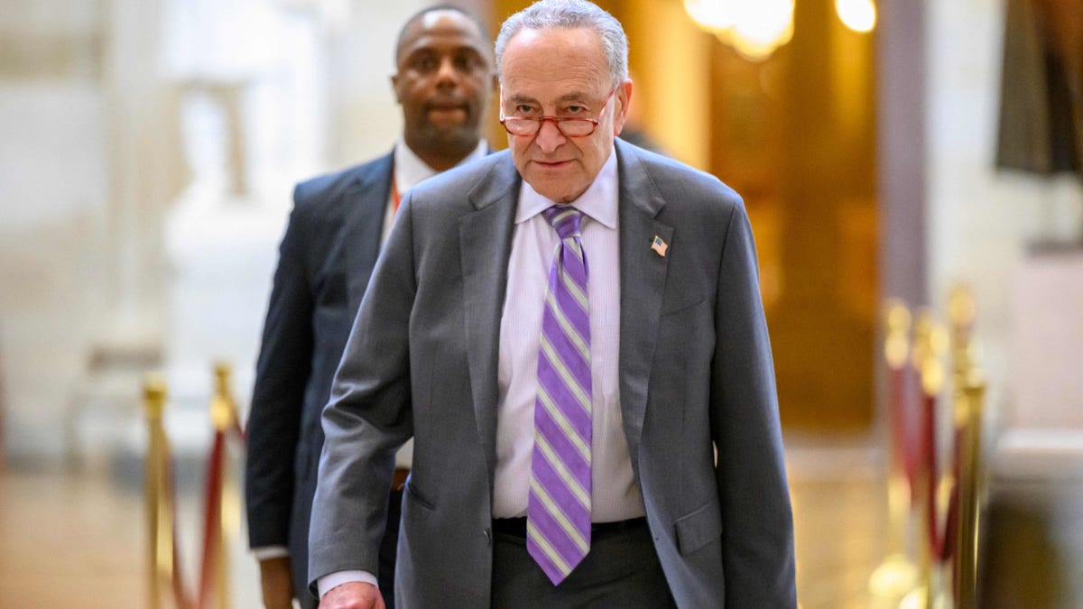 US Senate Majority Leader Chuck Schumer walks through the halls of Congress