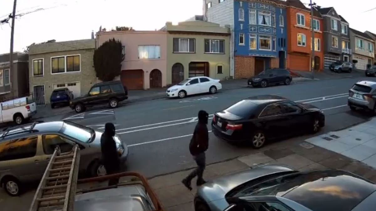 Suspects walking down street in all black