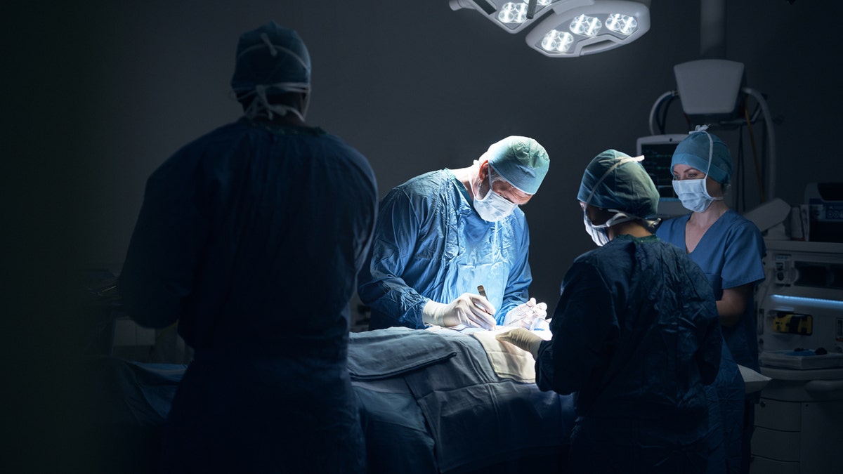 Surgeons operating