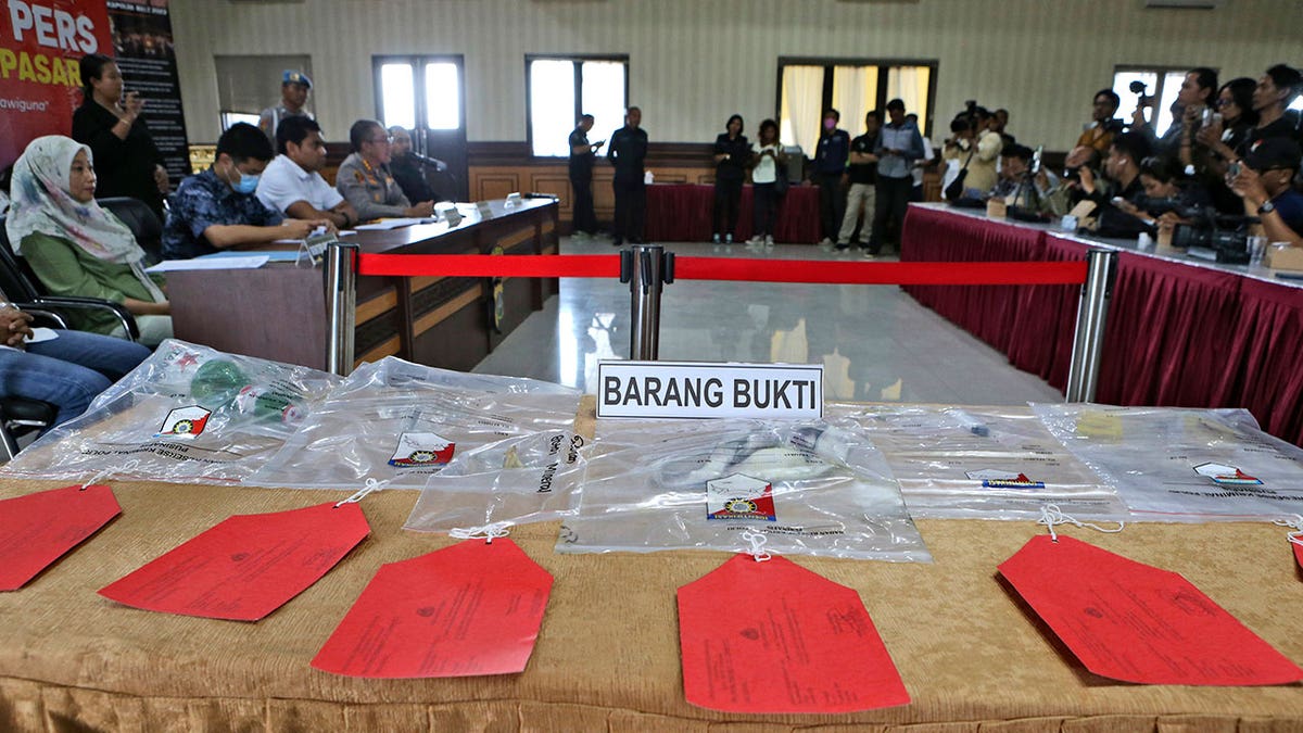 Evidence collected from the hotel where two Chinese tourists were found dead are displayed during a police press conference in Bali, Indonesia, on May 17, 2023. 