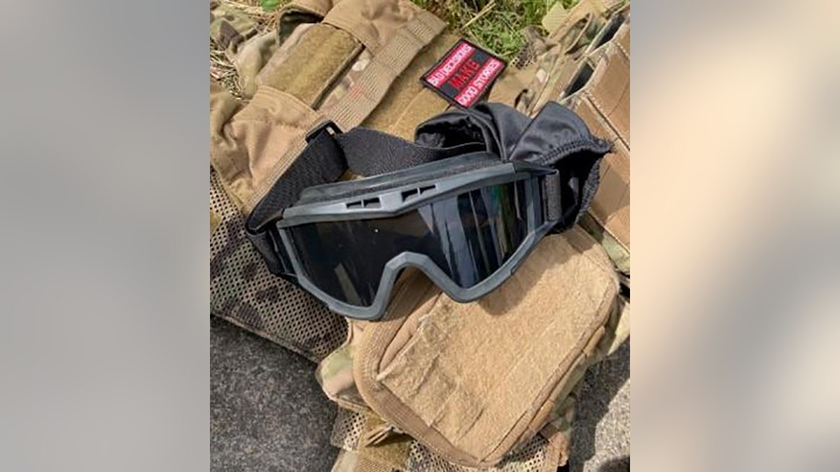 tactical vest and goggles