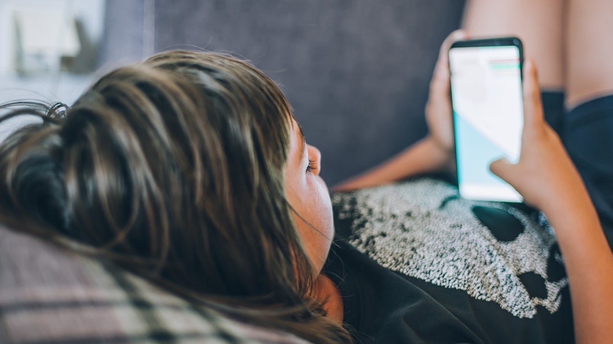 Girl scrolling social media