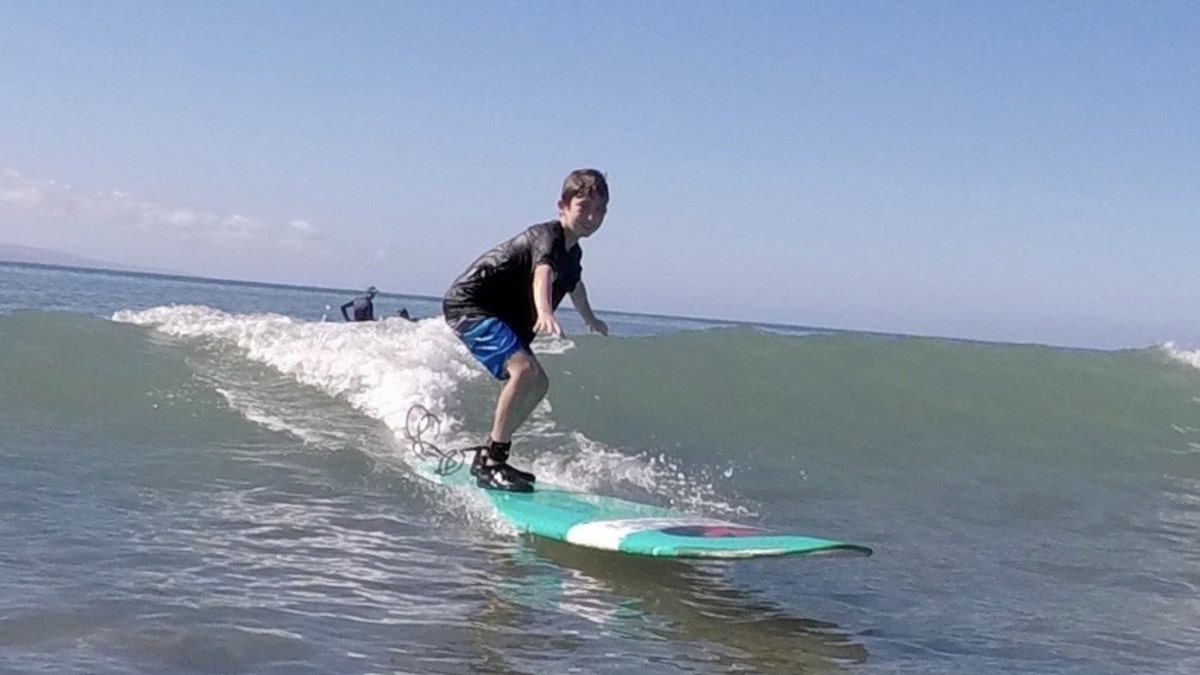 Nate Bronstein on a surfboard