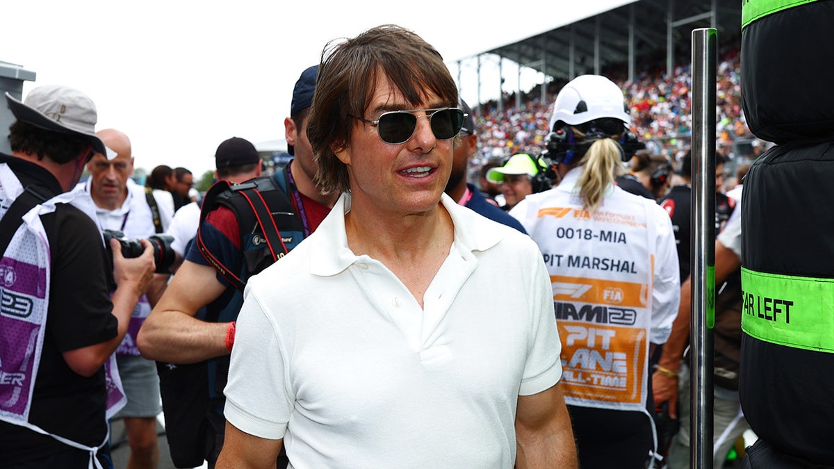 Tom Cruise wears white polo shirt and sunglasses at F1 Grand Prix in Miami