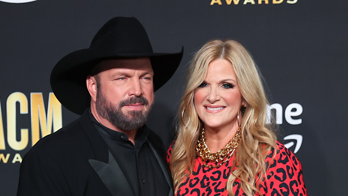 Trisha Yearwood smiling with Garth Brooks