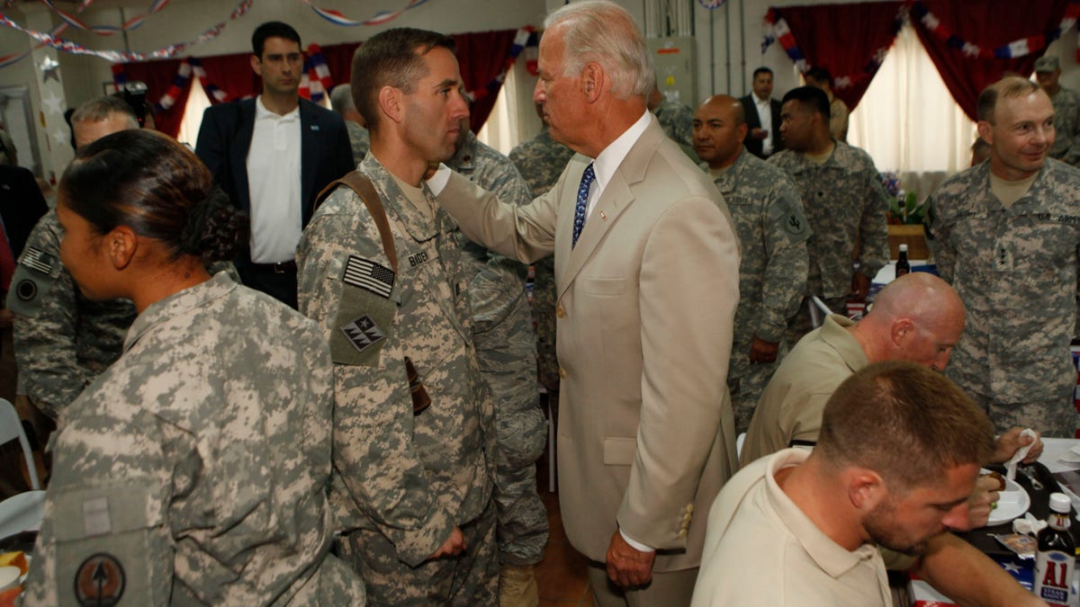 Then-vice president Joe Biden greets his son U.S. Army Capt. Beau Biden at Camp Victory on July,4, 2009 near Baghdad, Iraq